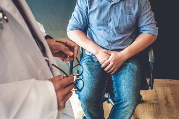 man with symptoms of prostatitis at a doctor's appointment